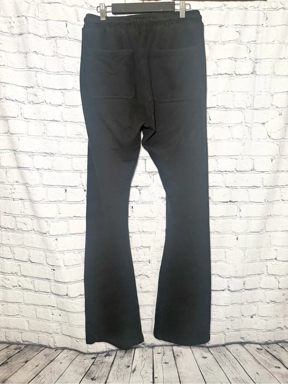 Novamen black graphic flare sweat pants. Size L